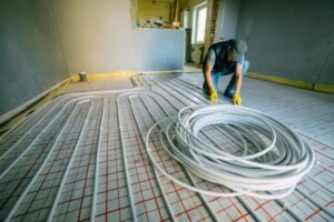 Pipefitter installing system of heating. Repair in the apartment